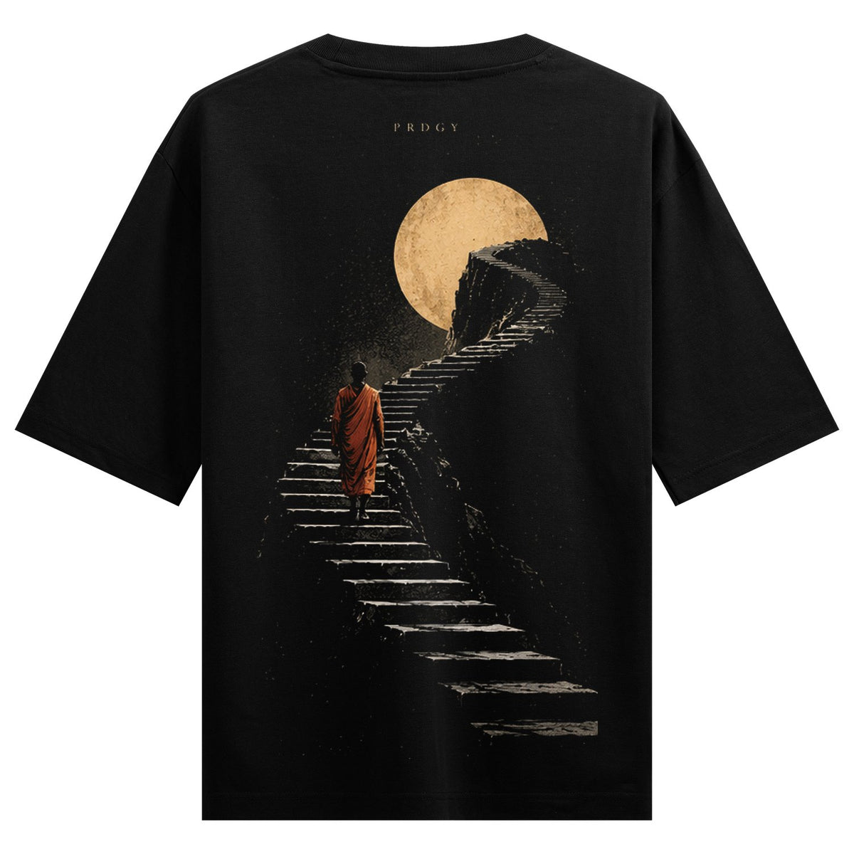 Ascension Path Oversized T-Shirt — a dark t-shirt features a monk in an orange robe walking up stone stairs towards a large