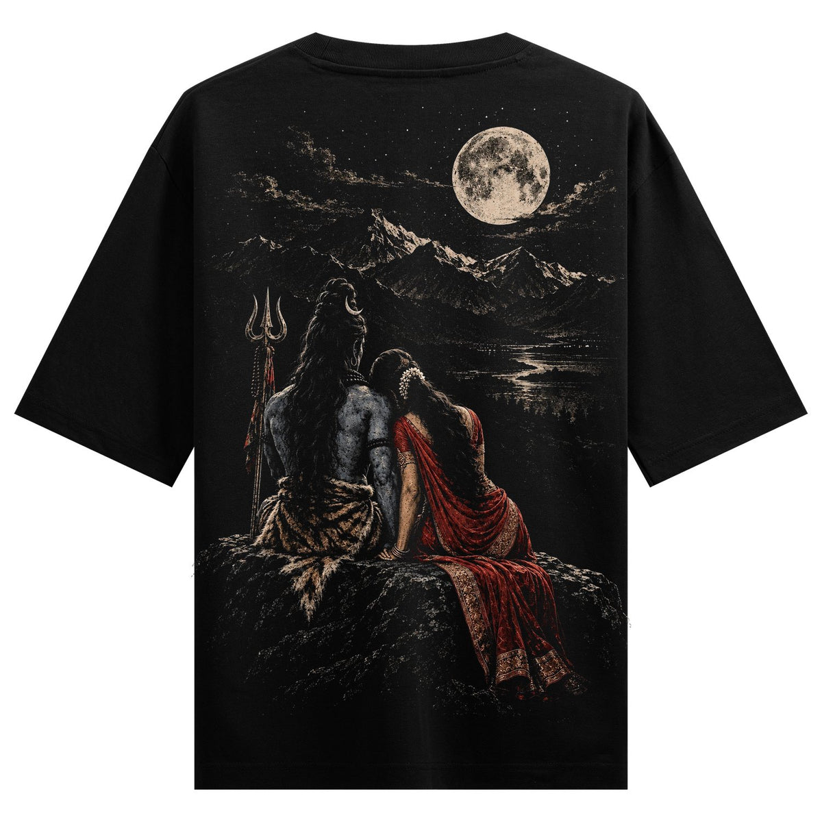 Moonlit Devotion Oversized T-Shirt — a couple sits on a rock, with Lord Shiva holding a trident and a full moon illuminating