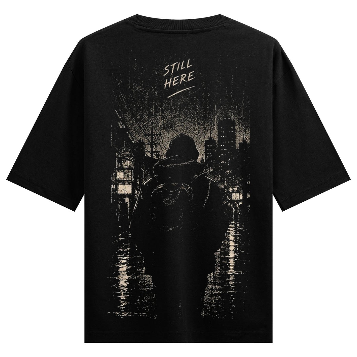 Urban Shadows Oversized T-Shirt — a hooded figure with a backpack stands in the rain, facing a city skyline under a dark sky