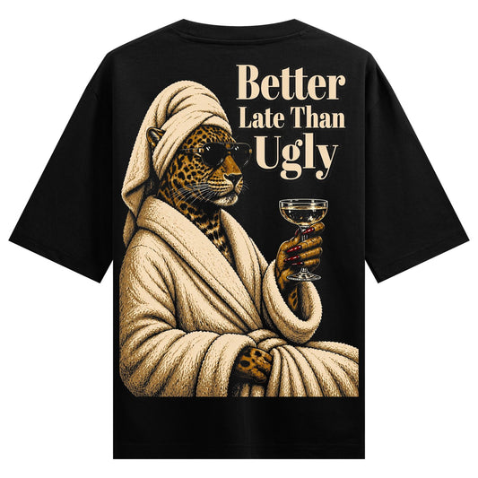 A leopard wearing sunglasses and a turban draped in a beige bathrobe holds a champagne glass with red-tipped fingers on PR...