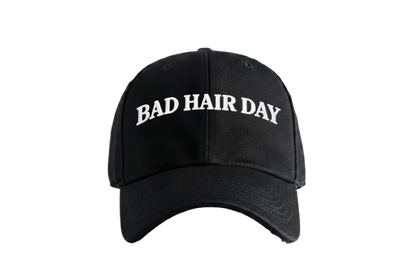 Bad Hair Day Cap by PRDGY — Bold white text reading 'BAD HAIR DAY' on a black cap, humorous design.
