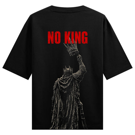 A dark robed figure with a crown held high on a black background featuring bold red text above on PRDGY oversized t-shirt