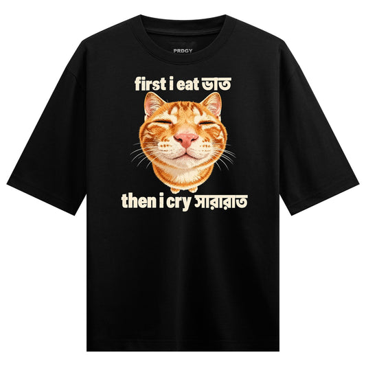 A photorealistic orange cat face with closed eyes surrounded by white text in English and Bengali script on a black tee on...