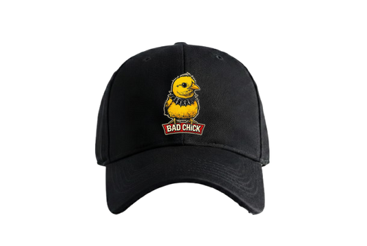 A yellow chick with a spiked collar stands on a red banner that reads BAD CHICK on a black t-shirt on PRDGY oversized t-shirt