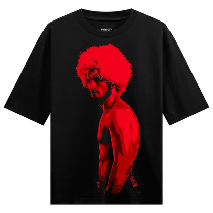 A red silhouette of a muscular man with an afro hairstyle shown in side profile on a black t-shirt on PRDGY oversized t-shirt