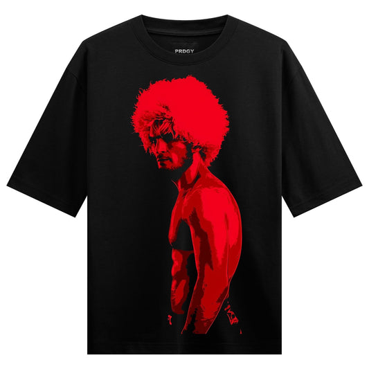 A red silhouette of a muscular man with an afro hairstyle shown in side profile on a black t-shirt on PRDGY oversized t-shirt