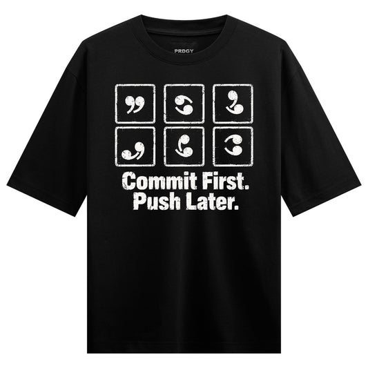 Commit Push Oversized T-Shirt — Black t-shirt with white distressed text and symbols in a grid layout