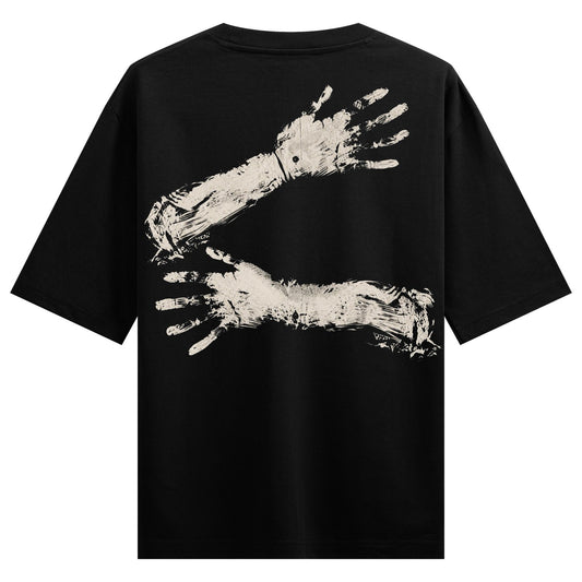 A black t-shirt features a distressed off-white graphic of two arms and hands embracing rendered with visible brush stroke...
