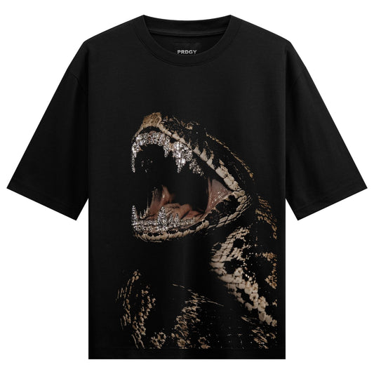 A black t-shirt features a close-up dark illustration of a snake s head with its mouth open showcasing diamond-encrusted t...
