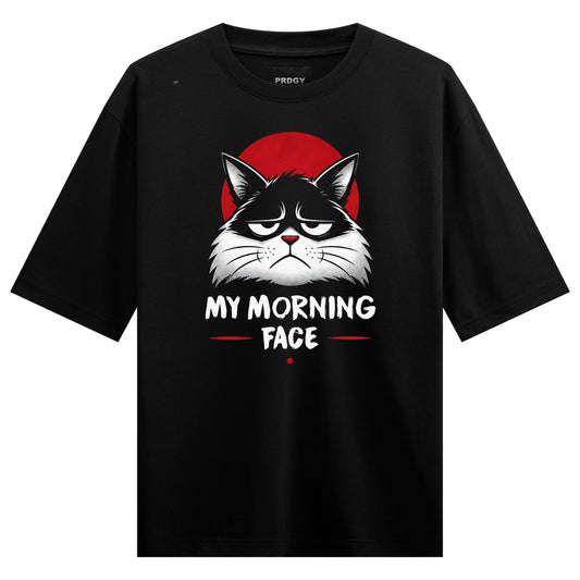A black t-shirt features a grumpy black and white cat face illustration with a red circle behind it and white text below o...