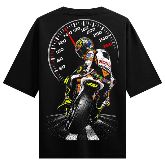 Speed Demon Oversized T-Shirt — a motorcycle racer in a colorful suit is depicted with a speedometer in the background