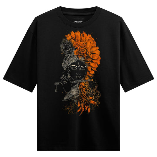 A black t-shirt features a line art depiction of Lord Krishna playing a flute with a large headdress of orange flowers and...