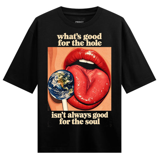 Earth Lollipop Oversized T-Shirt — a black t-shirt features a graphic of red lips and a tongue licking an Earth-shaped