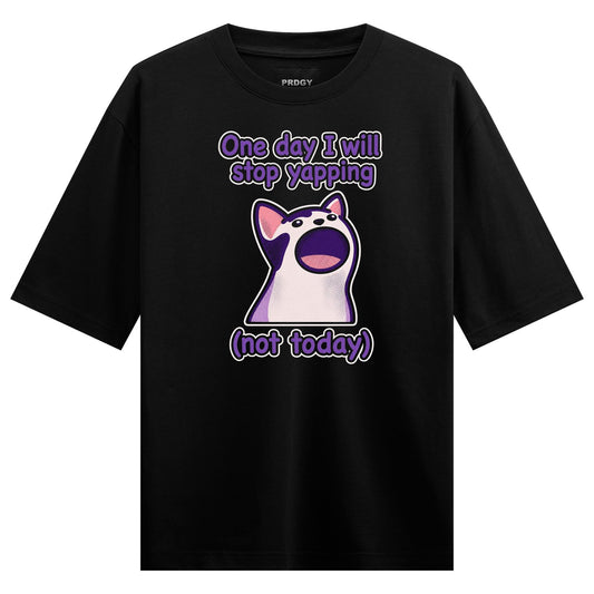 A black t-shirt features a cartoon cat with a wide open mouth and purple text above and below it on PRDGY oversized t-shirt