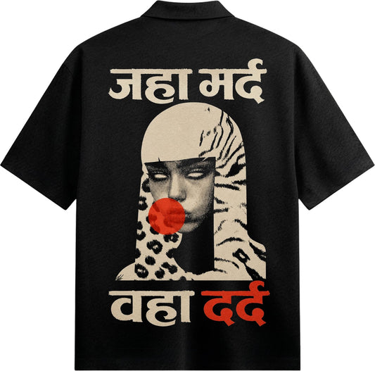 A black t-shirt features a graphic of a face with white eyes a red circle on the mouth surrounded by tiger stripes and leo...