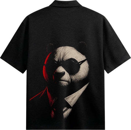 A black t-shirt features a close-up illustration of a panda wearing black sunglasses and a suit with dramatic red and whit...