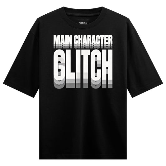 Main Character Glitch Oversized T-Shirt — Black t-shirt with bold white glitch-style text reading 'MAIN CHARACTER GLITCH'