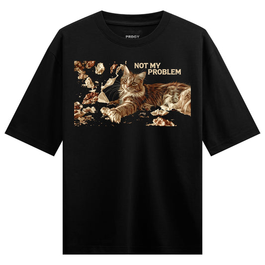 Cat Problem Oversized T-Shirt — a fluffy brown cat lies surrounded by broken mirror shards with text reading NOT MY PROBLEM