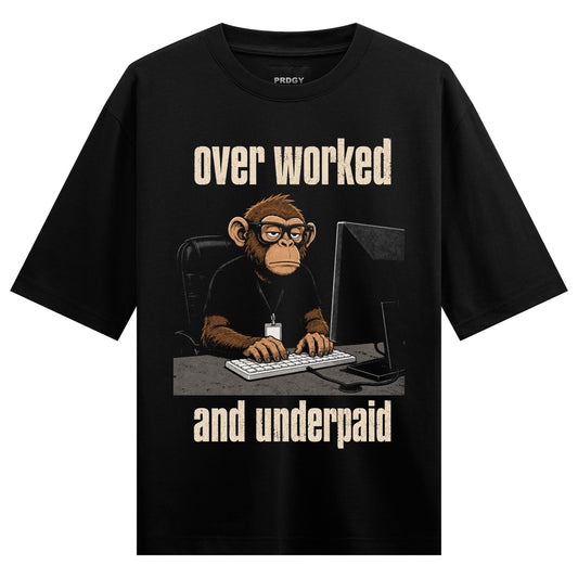 A cartoon chimpanzee with glasses sits at a desk typing on a keyboard in front of a computer monitor with text above and b...
