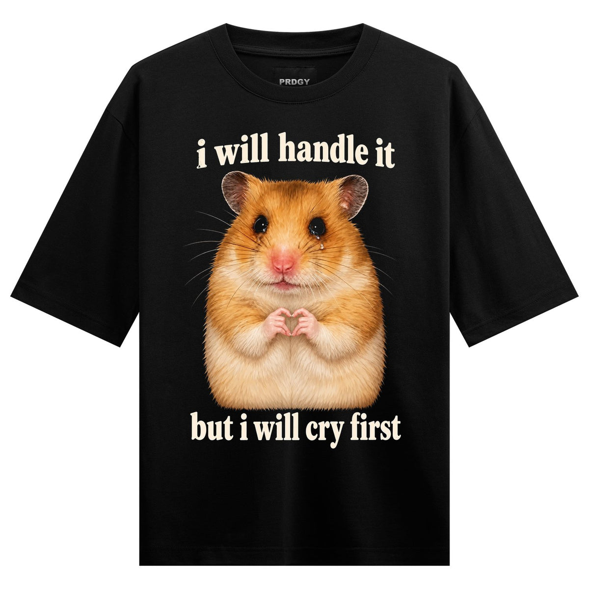 Cry First Oversized T-Shirt — a photorealistic image of a crying hamster with its paws in a heart shape, set against a black