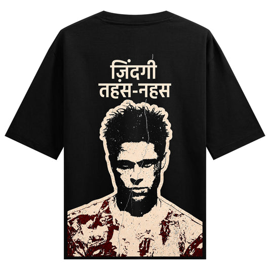 A black t-shirt features white Hindi text above a distressed high-contrast portrait of a man with red splatters on his shi...