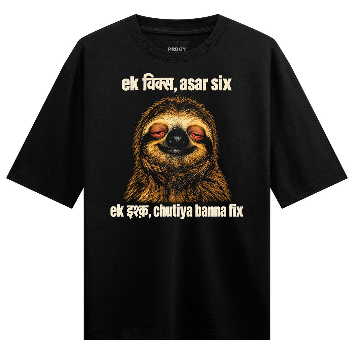 A brown sloth with half-closed eyes smiling overlaid with cream-colored Hindi text on a black tee on PRDGY oversized t-shirt