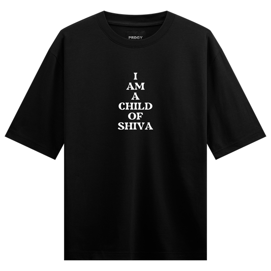 A black t-shirt features white stacked text reading I AM A CHILD OF SHIVA with a small PRDGY logo above on PRDGY oversized...