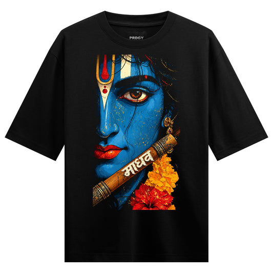 Blue Kanha Oversized T-Shirt — a blue-skinned deity portrait with red lips, third eye, flute, and marigold flowers