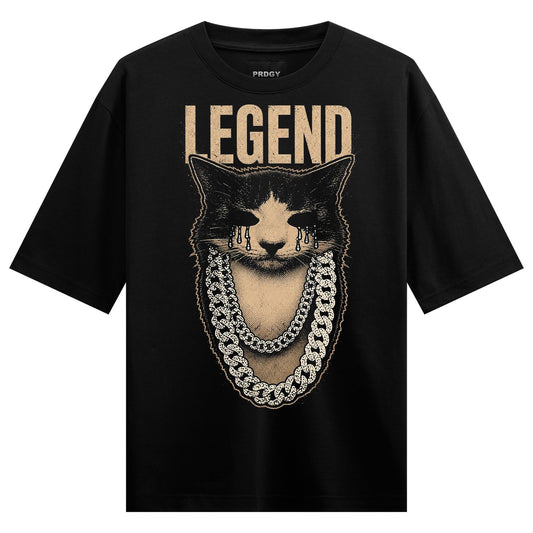 A black and white cat face with golden tears and a thick gold chain set against a cream background with the word LEGEND ab...