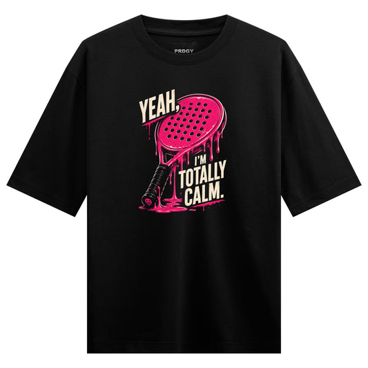 A black t-shirt with a pink graphic of a paddle dripping pink liquid accompanied by bold white text on PRDGY oversized t-s...