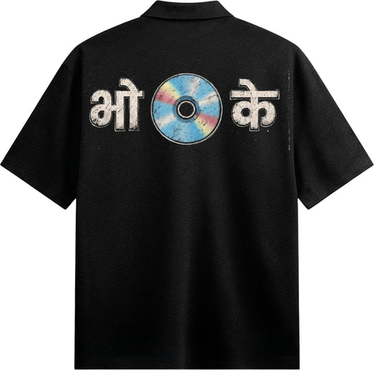 The back of a black collared shirt features Hindi text and a colorful distressed CD graphic with blue pink and yellow hues...