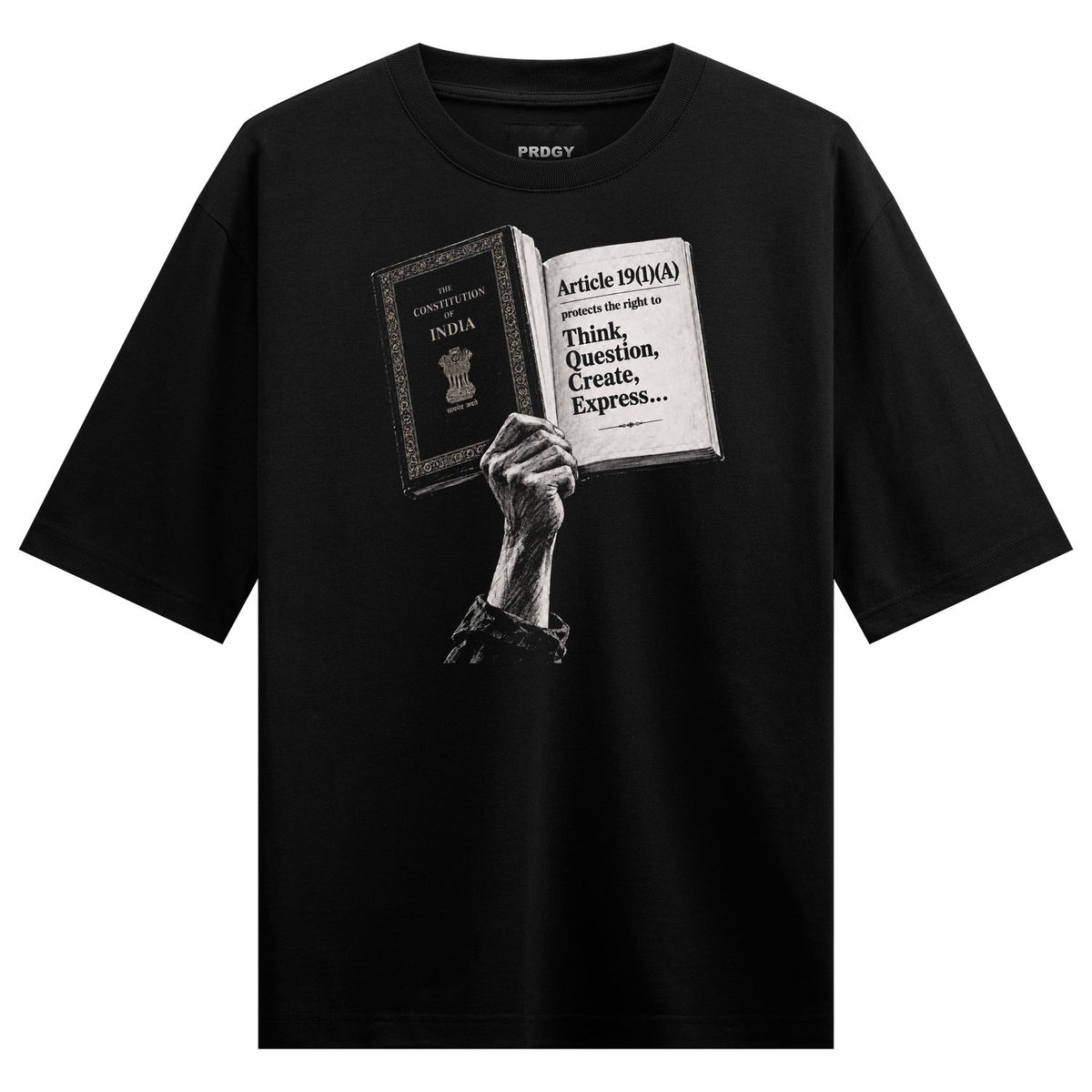 Constitution Hand Oversized T-Shirt — a white graphic of a raised fist holding an open book showing text and Ashoka pillar
