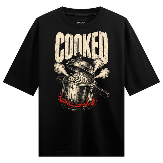 Brain Cooked Oversized T-Shirt — a white cracked 'COOKED' text above a pot boiling a brain with steam and red flames