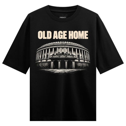 Old Age Home Oversized T-Shirt — cream-colored text reading 'OLD AGE HOME' above a grayscale illustration of a large