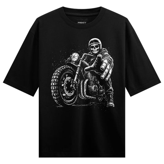 A black t-shirt features a white graphic of a skeletal biker on a motorcycle pointing directly at the viewer with a detail...