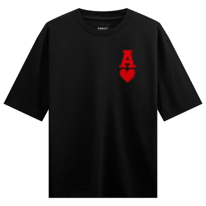 A black t-shirt features a prominent red ace of hearts graphic with distressed texture and the brand name PRDGY above it o...