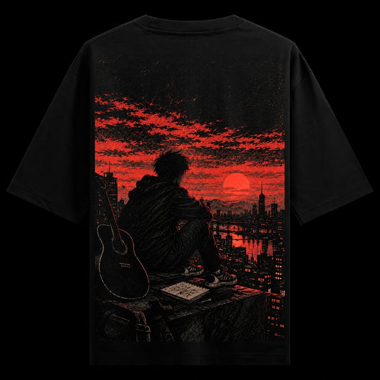 Red Sky Solitude Oversized T-Shirt — a person sits on a rooftop with an acoustic guitar and skateboard beside them