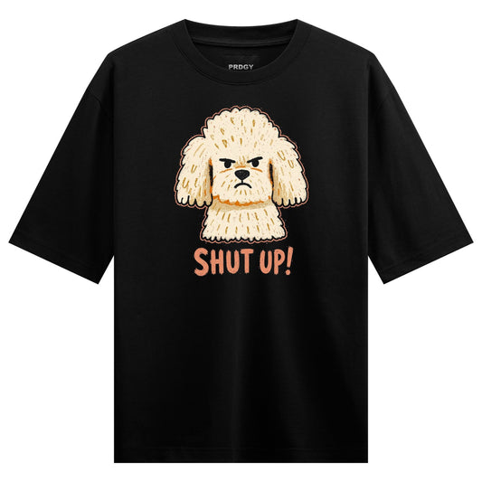 A black t-shirt features a cartoon illustration of a fluffy white poodle with a grumpy expression and the text SHUT UP bel...