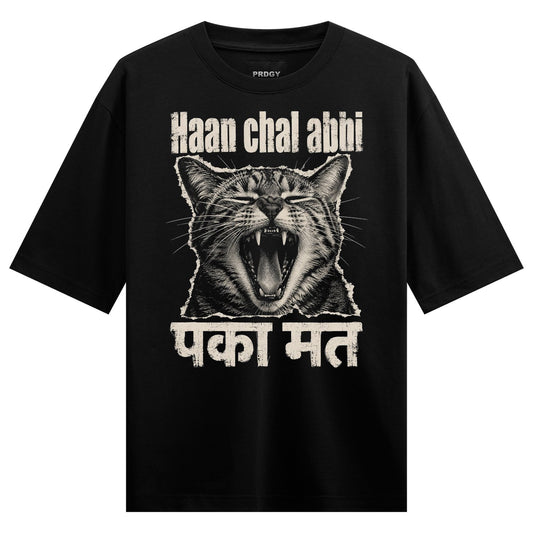 A black t-shirt features a detailed monochrome illustration of a cat yawning widely with white text above and below the im...