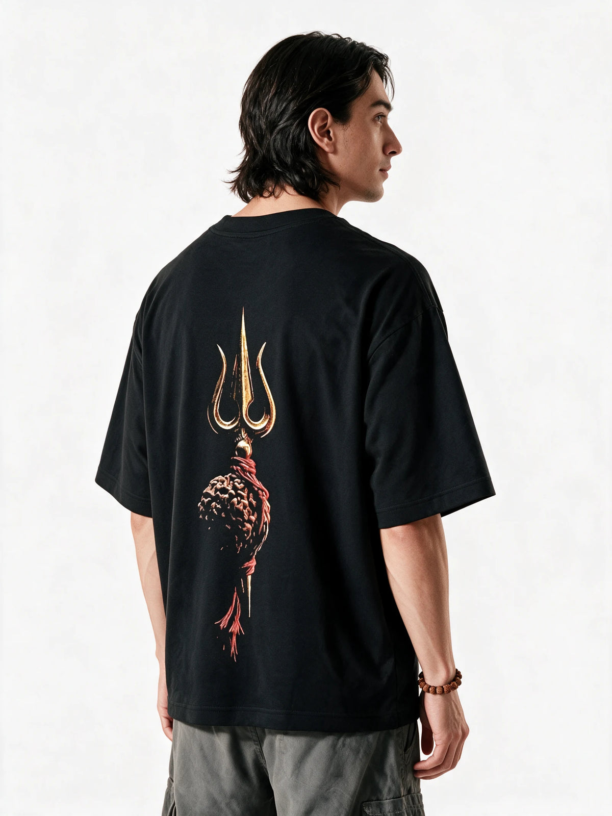 PRDGY Divine Trident Oversized T-shirt — back-print T-shirt at three-quarter angle