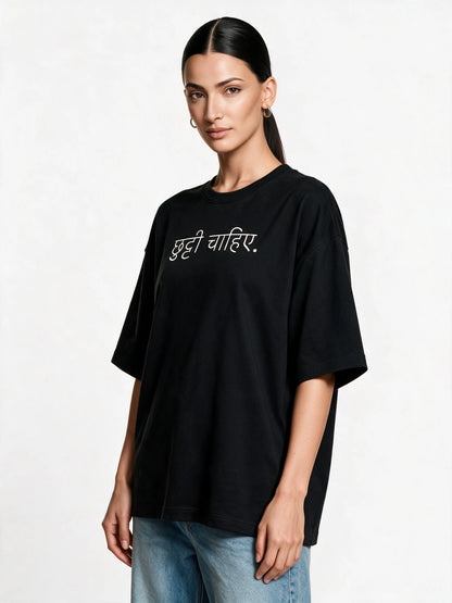 PRDGY Holiday Mode Oversized T-shirt — front-print T-shirt at three-quarter angle