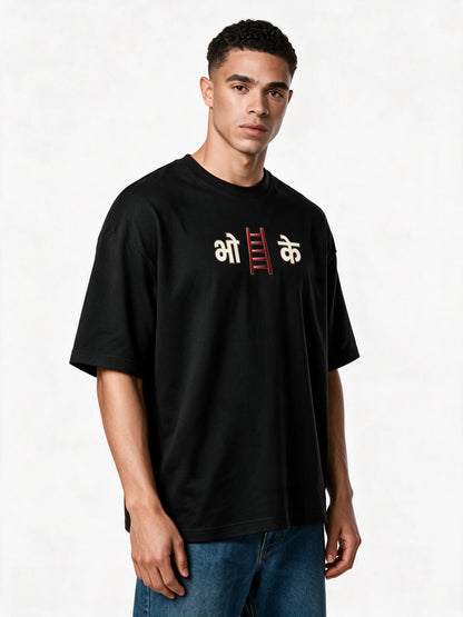 PRDGY Ladder Humor Oversized T-shirt — front-print T-shirt at three-quarter angle