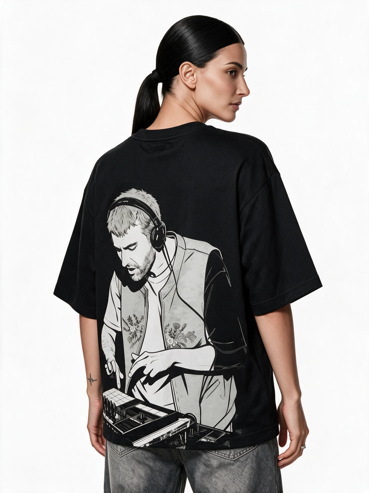 PRDGY Loop Theory Oversized T-Shirt — back-print T-shirt at three-quarter angle