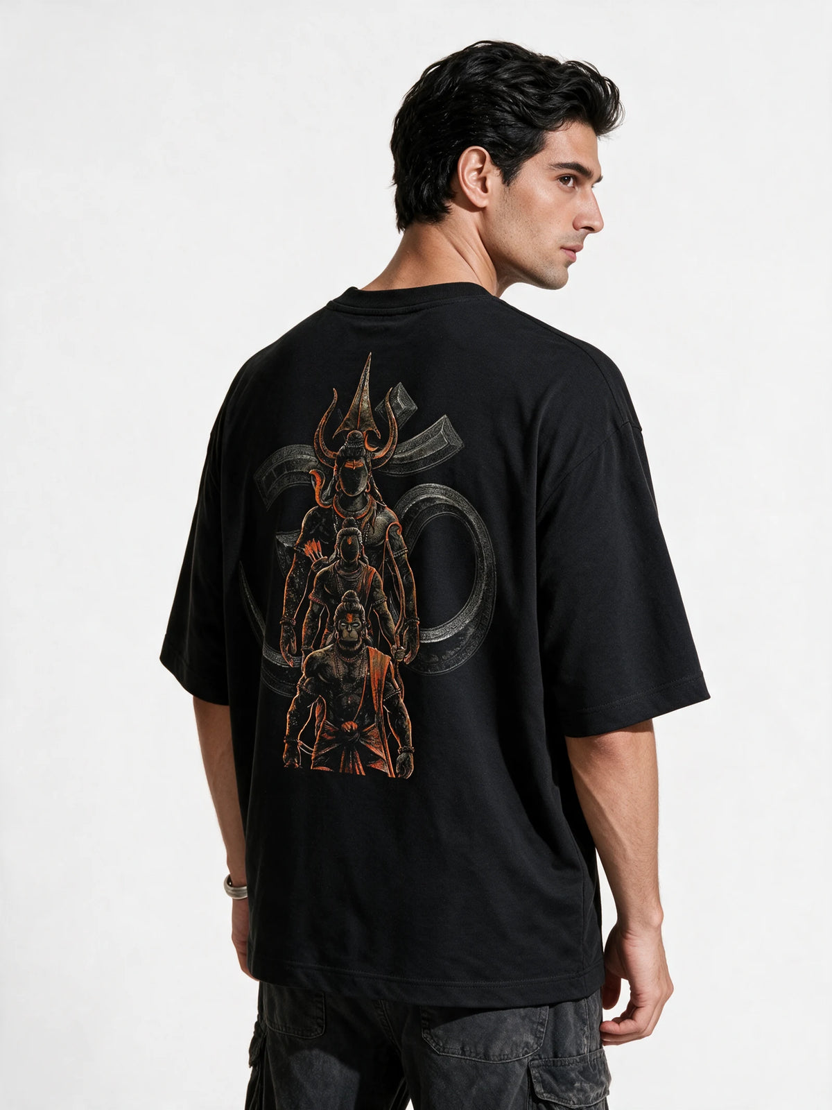 PRDGY Om Guardians Oversized T-Shirt — back-print T-shirt at three-quarter angle